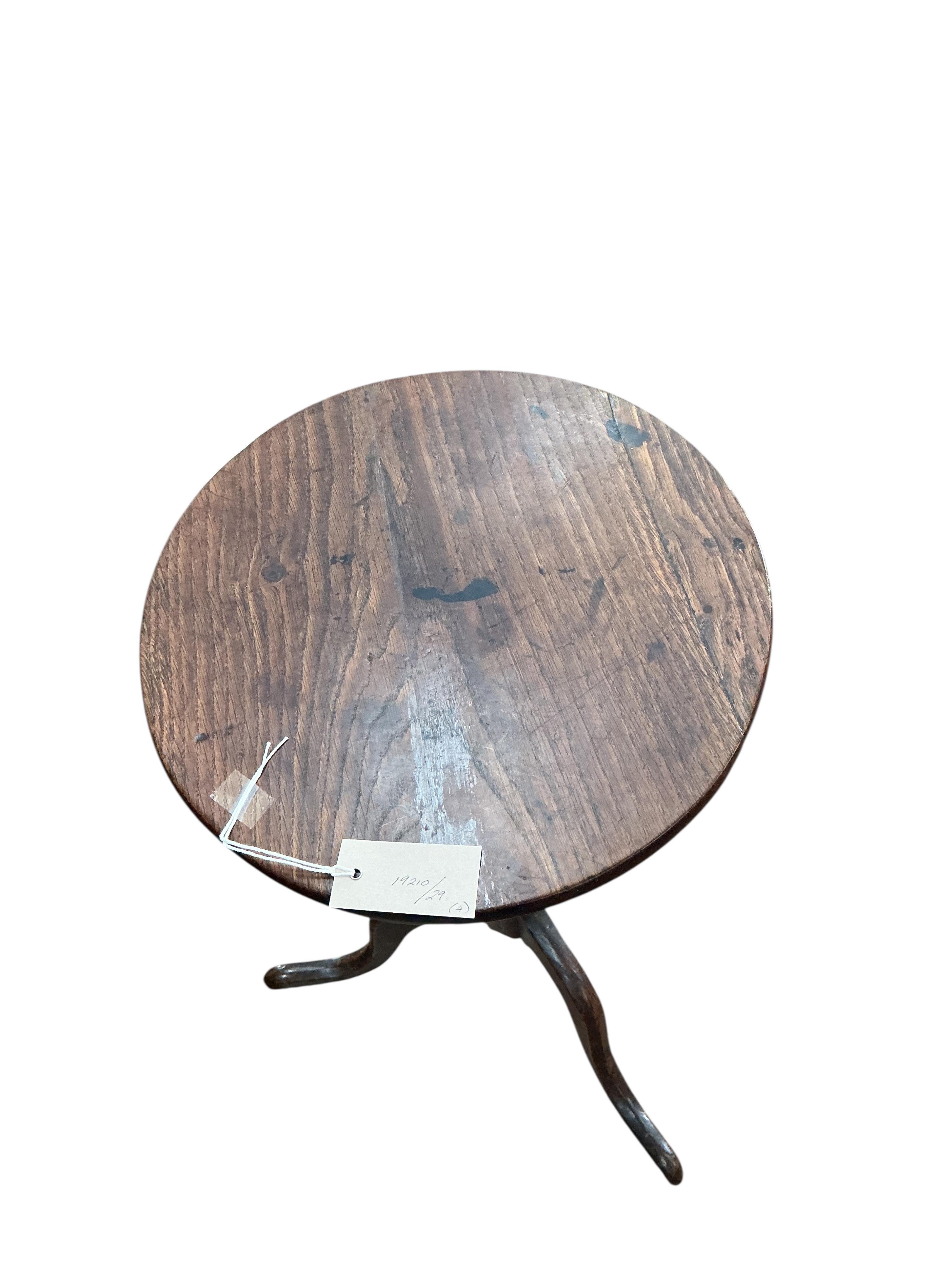 An early 19th century circular oak tripod wine table, diameter 36cm, height 64cm together with a carved step/stool, an inlaid table and one other